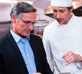 Experts discussing food in the kitchen