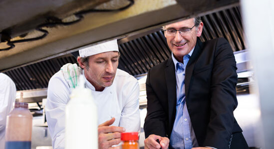 Experts discussing food in the kitchen