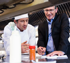 Experts discussing food in the kitchen